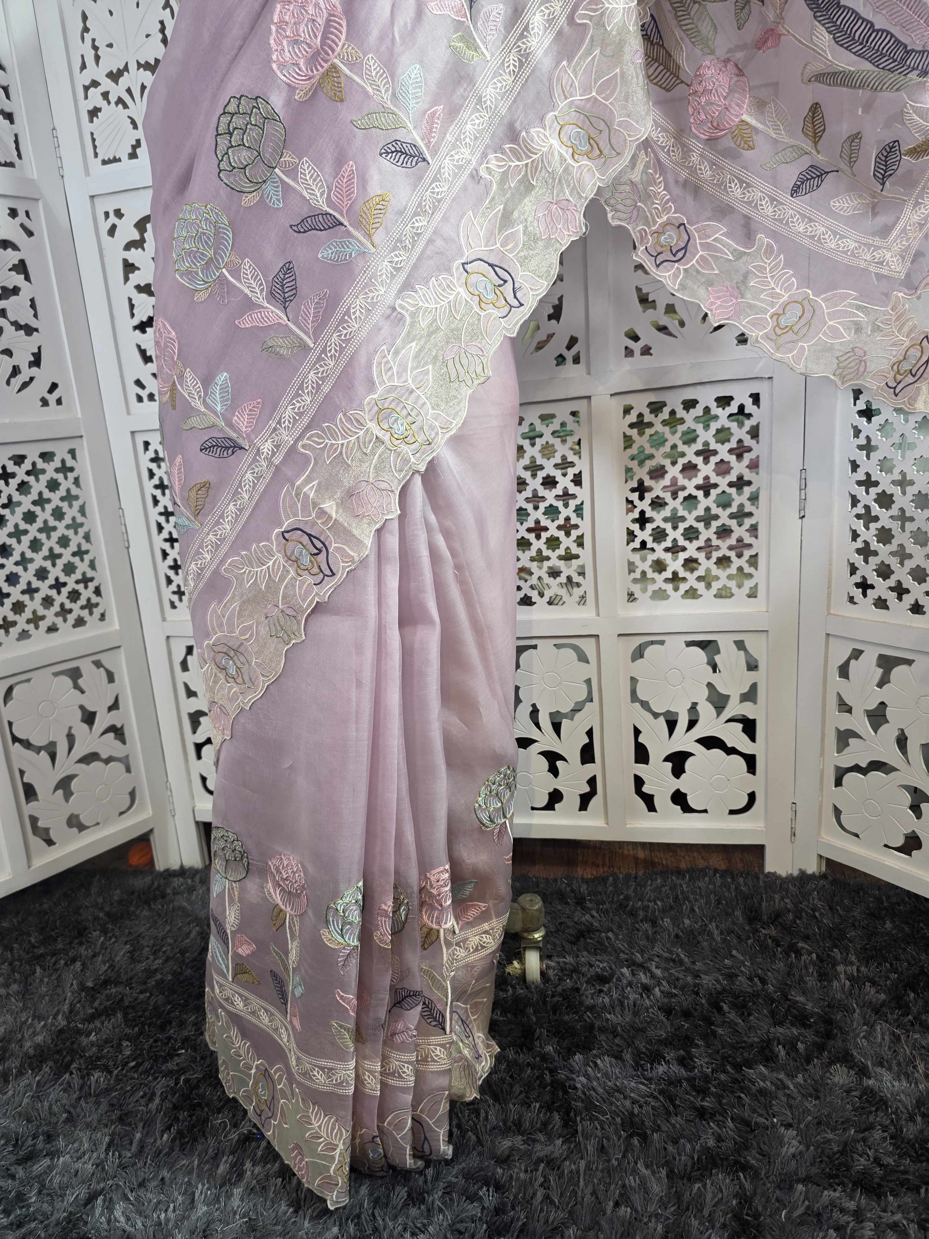 pure kora organza silk saree with beautiful multi resham thread work intricate imbroidery it has beautiful tissue applique and cutwork detailing along with this fully embroidered jaal work blouse