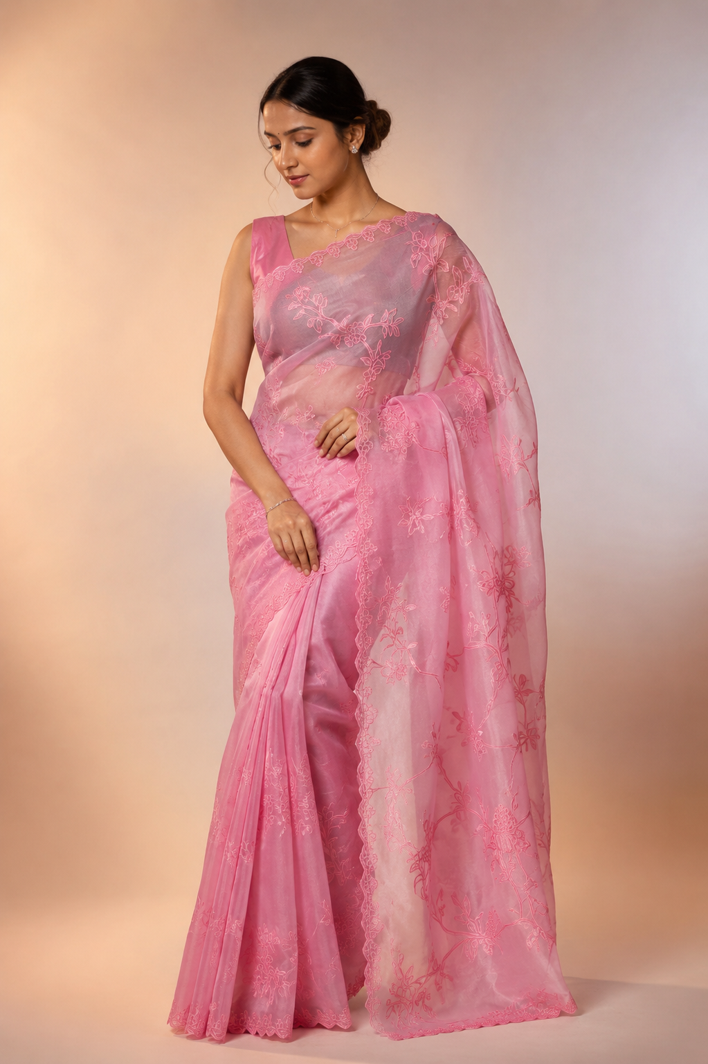Organza saree featuring exquisite pure dopyan appliqué embroidery work.