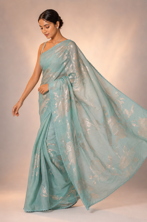 Organza saree crafted with delicate tissue and lustrous zari work